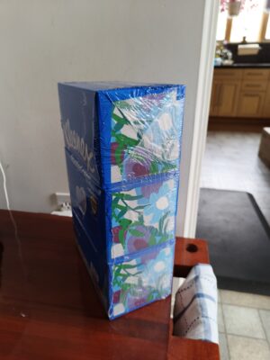 A 3-pack of tissues where all three boxes are blue and none are green.