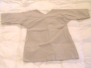 A beige, scrub-like tunic