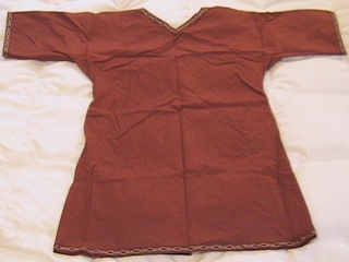 A red-brown tunic with interesting trim