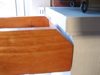The beveled end of the dining room shelf.