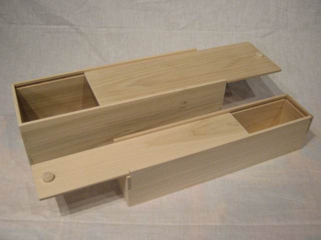 Two long boxes with sliding lids