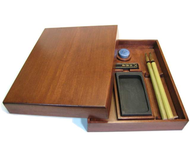 A wooden box for storing writing supplies