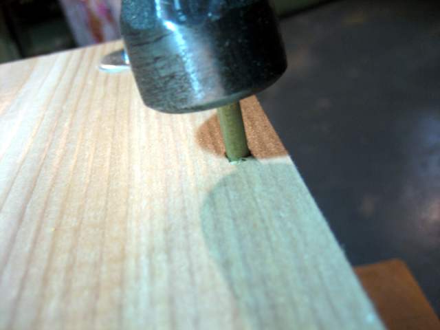 Tapping a peg into place